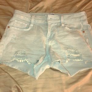 Blue ripped shorts